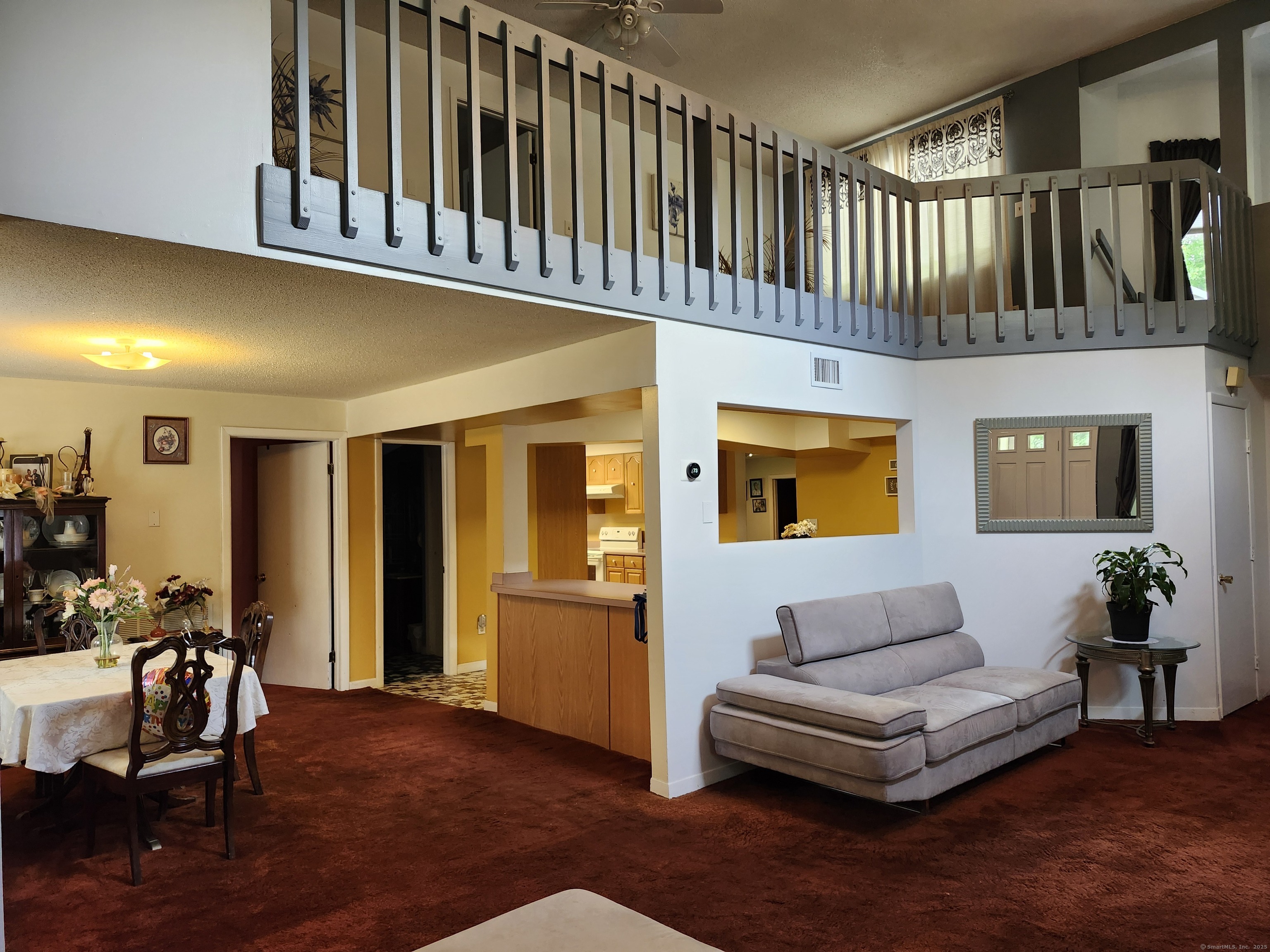 39 Loren Circle Windsor, CT 06095 - Photo 8 of 16 a living room with furniture fireplace and windows