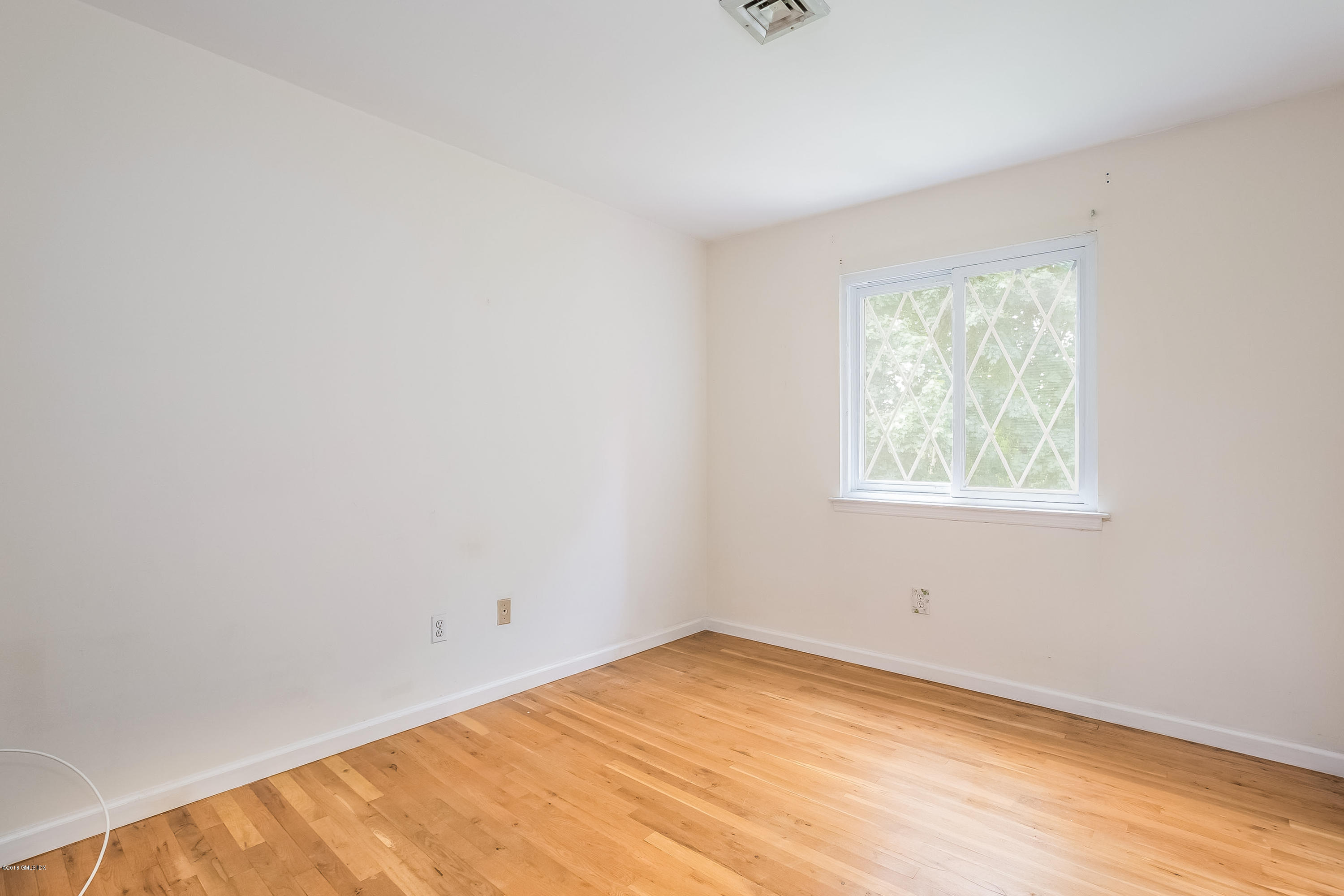 37 Sheep Hill Road, Unit 6 Riverside, CT 06878 - Photo 11 of 18 an empty room with a window