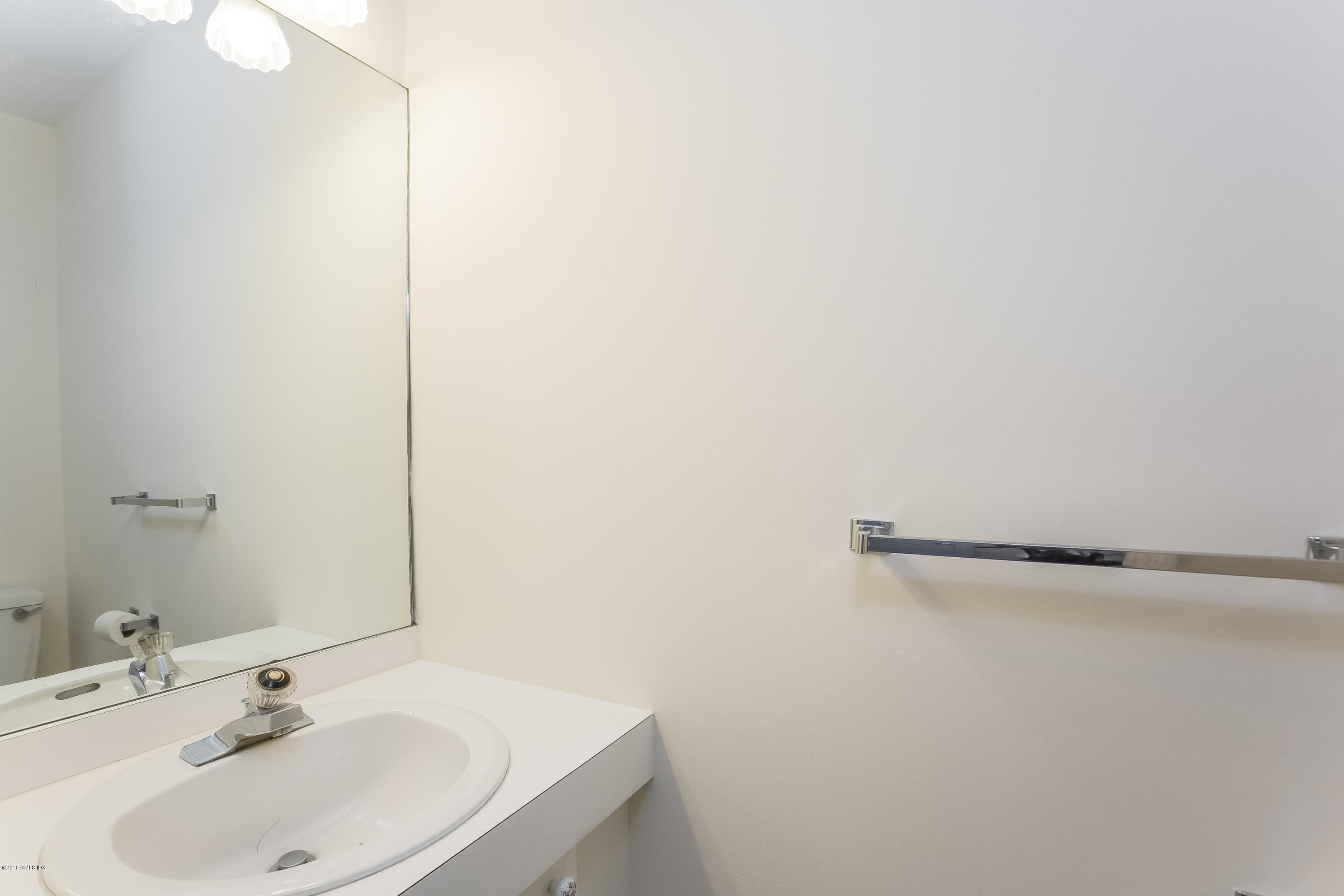 37 Sheep Hill Road, Unit 6 Riverside, CT 06878 - Photo 12 of 18 a bathroom with a sink and a mirror