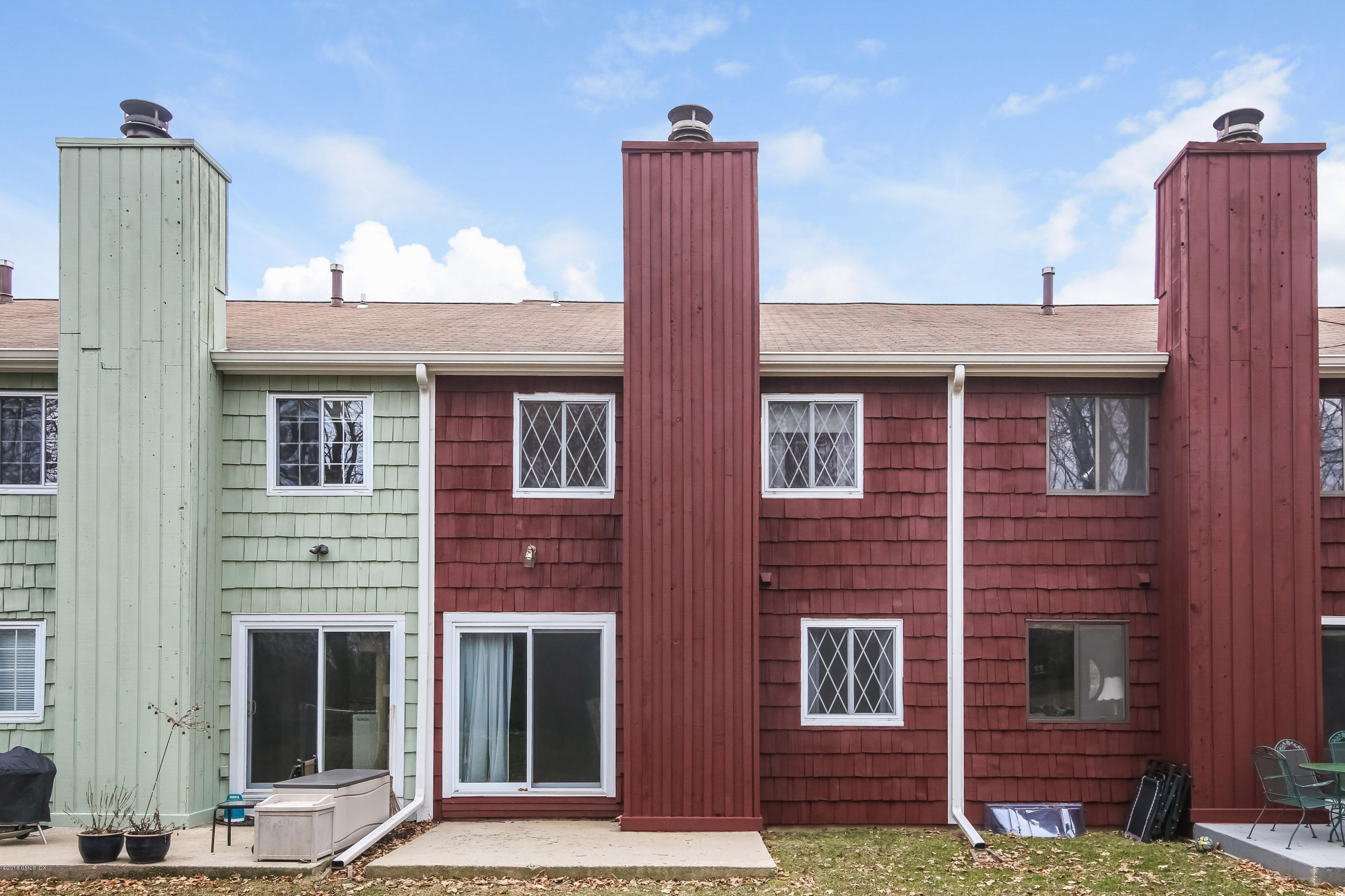 37 Sheep Hill Road, Unit 6 Riverside, CT 06878 - Photo 14 of 18 a front view of a house with a yard