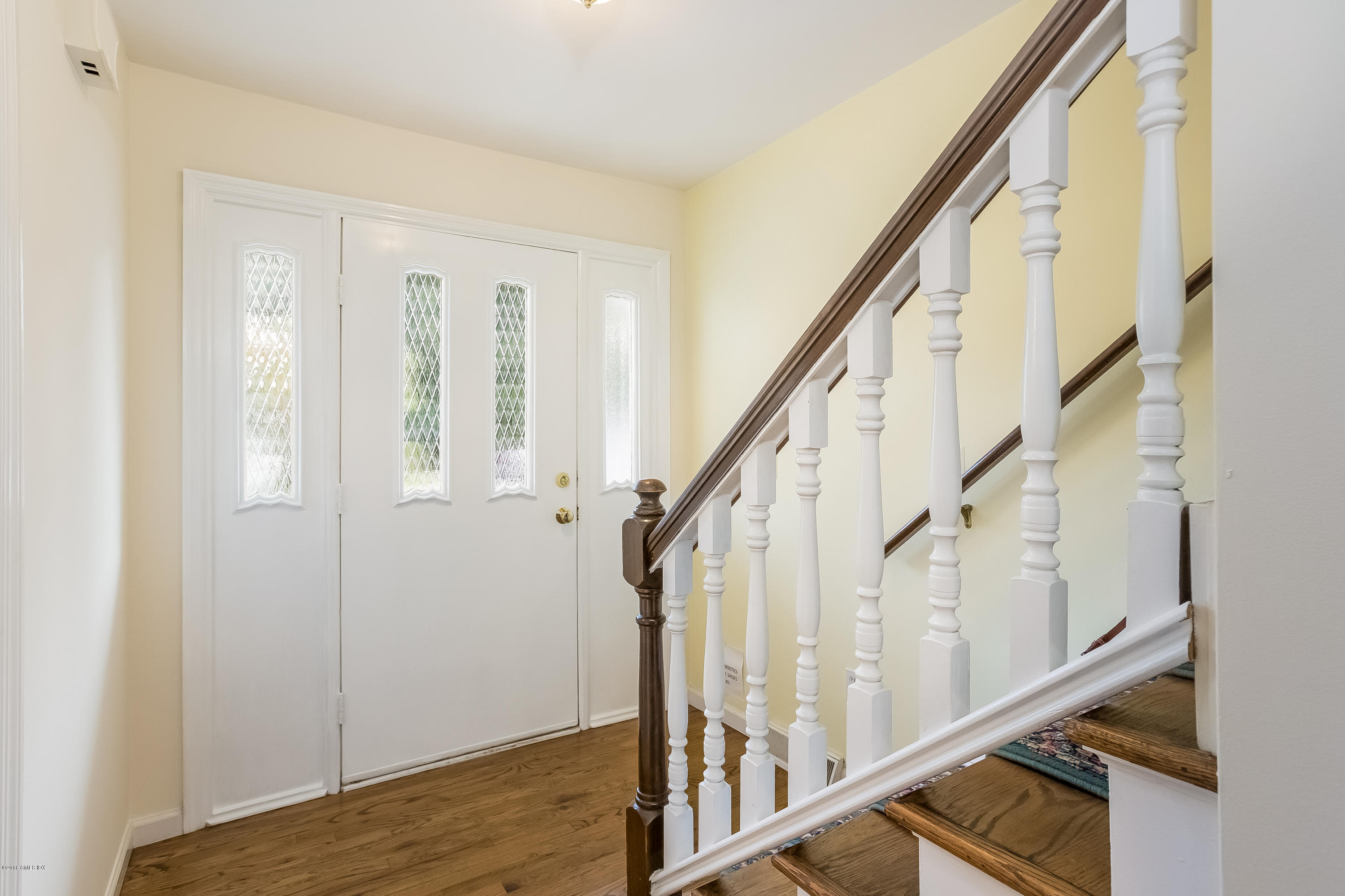 37 Sheep Hill Road, Unit 6 Riverside, CT 06878 - Photo 2 of 18 a view of an entryway with wooden floor