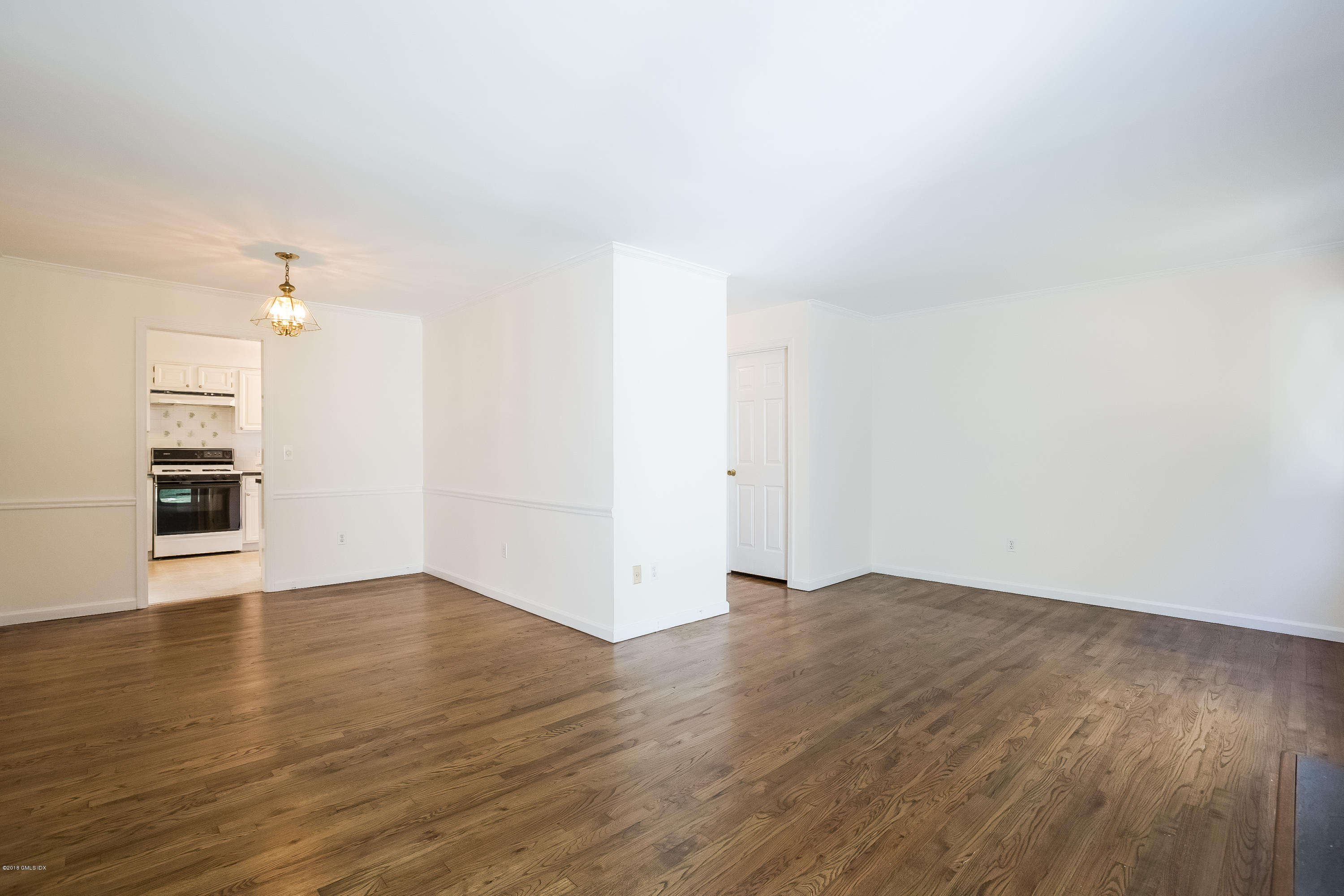 37 Sheep Hill Road, Unit 6 Riverside, CT 06878 - Photo 4 of 18 a view of an empty room with wooden floor and a window