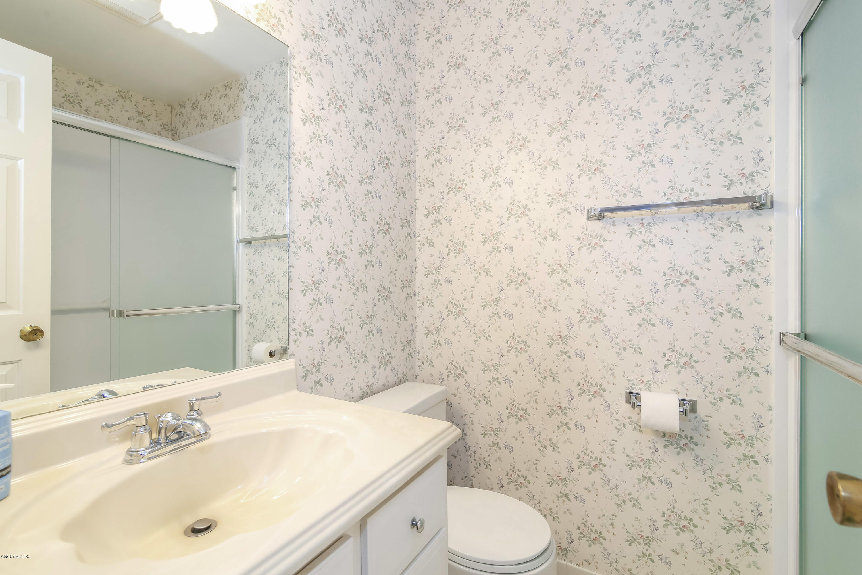37 Sheep Hill Road, Unit 6 Riverside, CT 06878 - Photo 9 of 18 a bathroom with a sink toilet and mirror