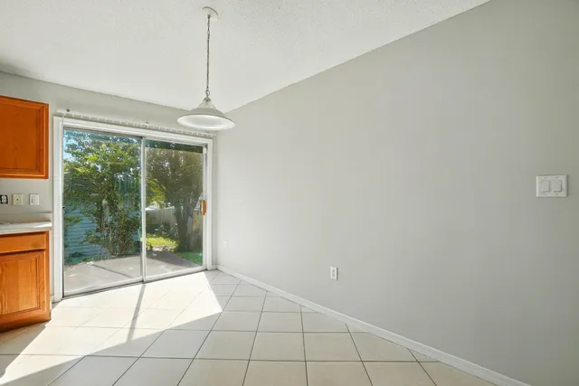 a room with sliding glass door and glass door