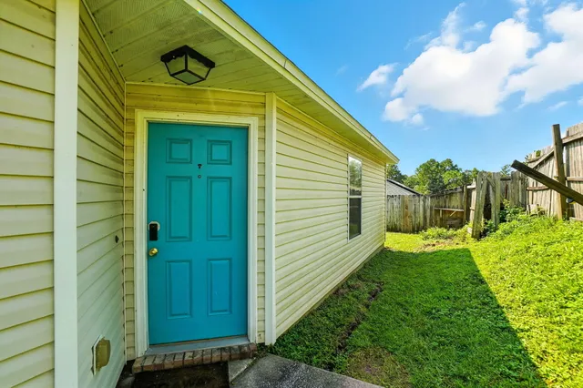 a view of a house with a small yard
