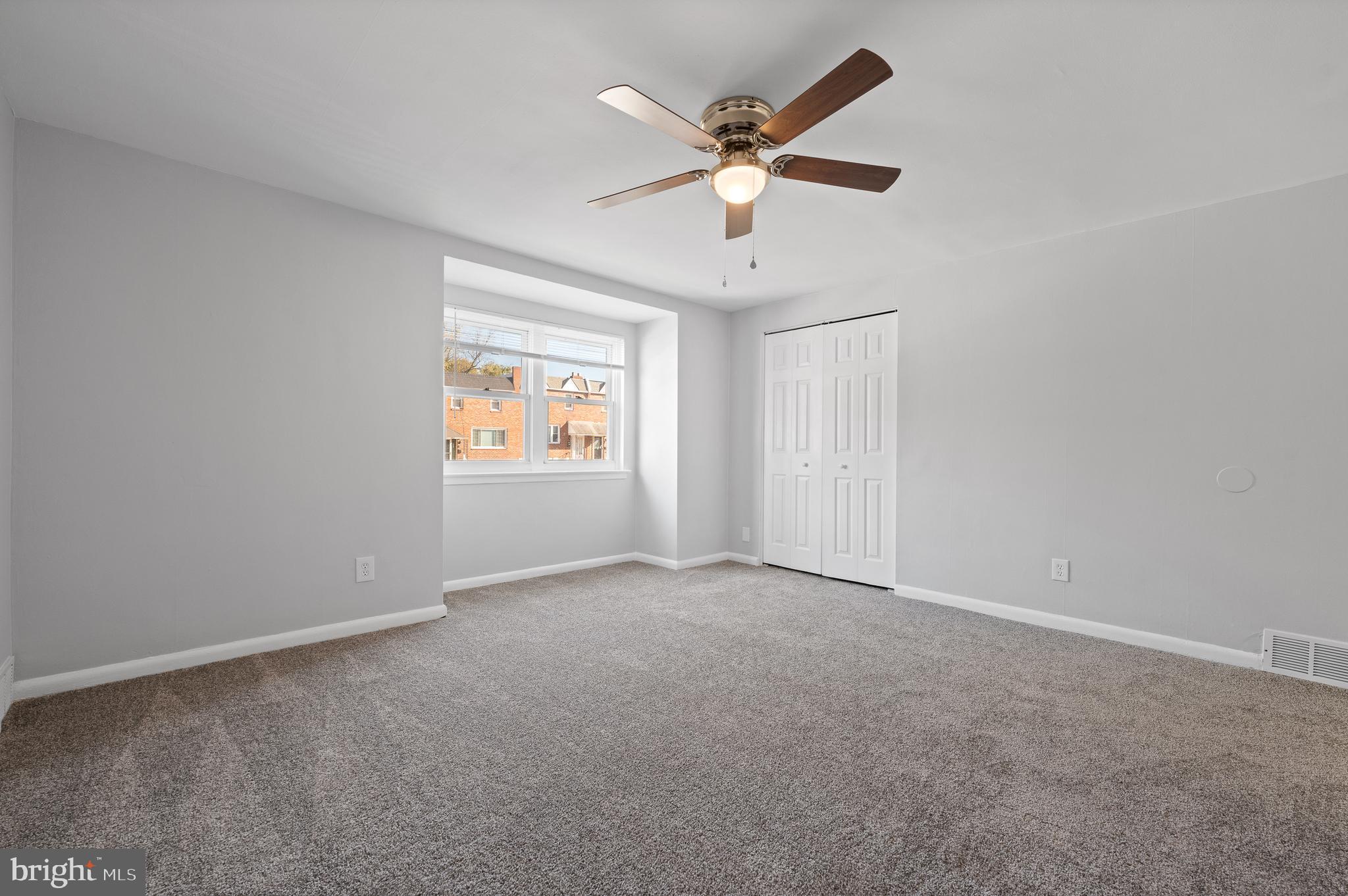 1222 Harshaw Road Brookhaven, PA 19015 - Photo 17 of 25 an empty room with windows and fan