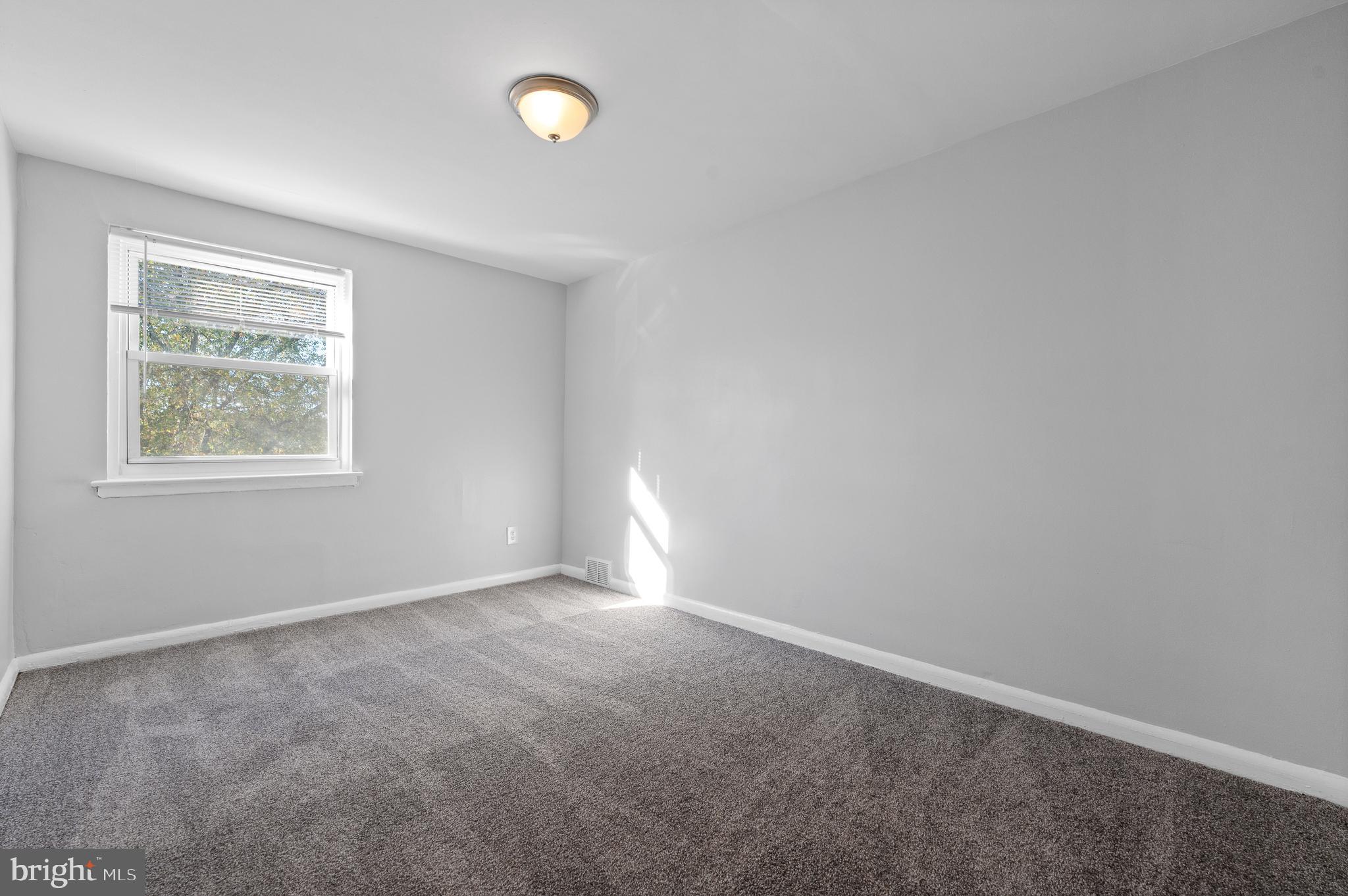 1222 Harshaw Road Brookhaven, PA 19015 - Photo 19 of 25 an empty room with windows