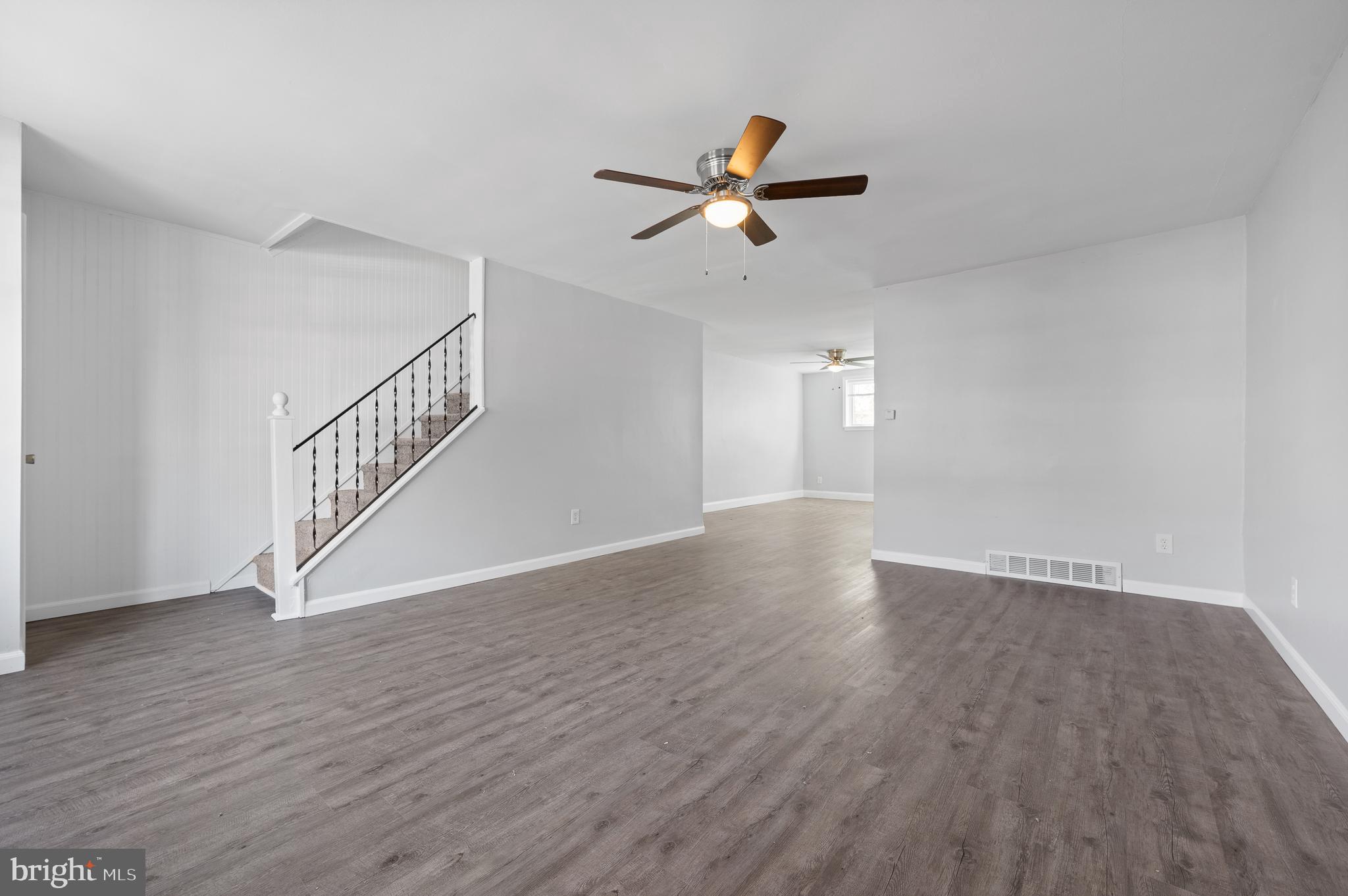 1222 Harshaw Road Brookhaven, PA 19015 - Photo 6 of 25 a view of empty room with wooden floor and ceiling fan