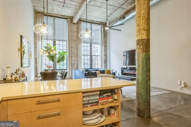 a bedroom with a bed and a table