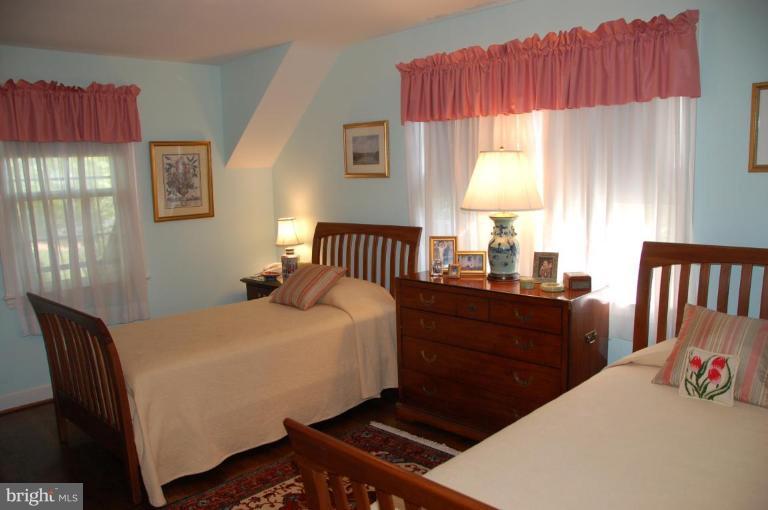 9507 Bruce Drive Silver Spring, MD 20901 - Photo 13 of 16 a bedroom with a bed and window