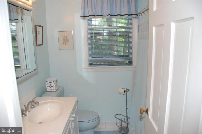 9507 Bruce Drive Silver Spring, MD 20901 - Photo 14 of 16 a bathroom with a toilet and shower