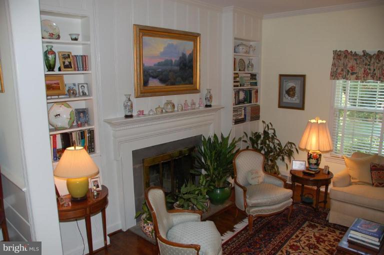 9507 Bruce Drive Silver Spring, MD 20901 - Photo 5 of 16 a living room with furniture and a fireplace