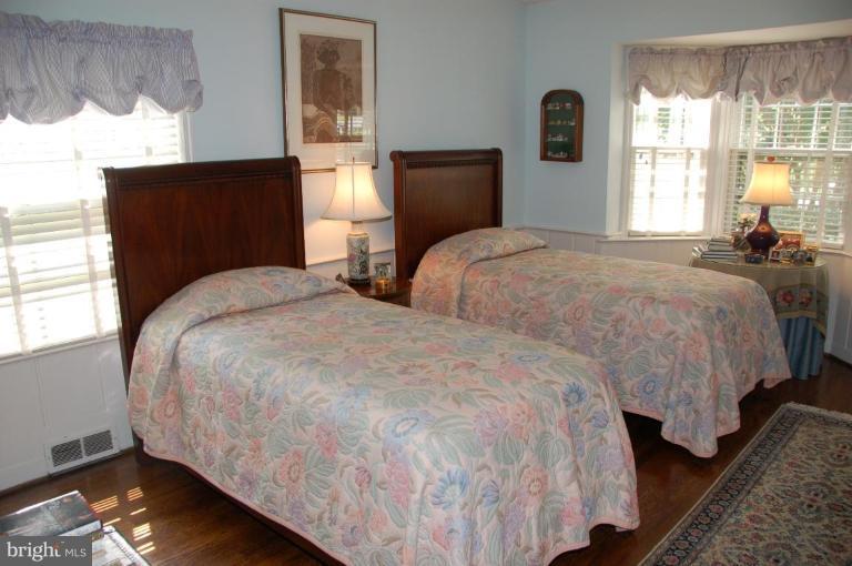 9507 Bruce Drive Silver Spring, MD 20901 - Photo 8 of 16 a bedroom with two beds and a window