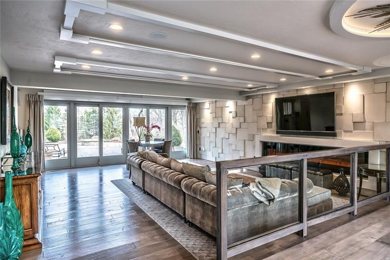 5 Little Meadow Road Wexford, PA 15090 - Photo 3 of 25 This open family room is bright and light and invites you to relax and enjoy the large patio through sliding doors and it's a great area for 3 season entertaining. 9 ft ceilings.
