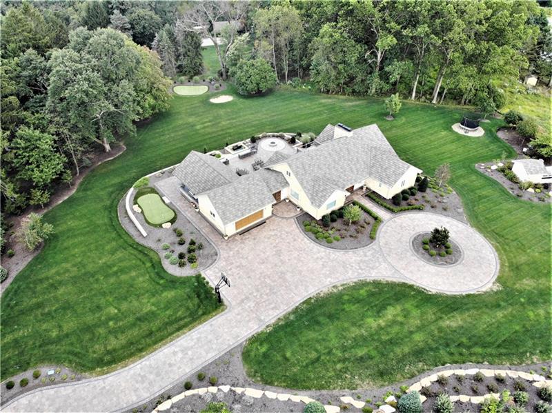 5 Little Meadow Road Wexford, PA 15090 - Photo 23 of 25 Aerial View of 2.2 Acre Private Oasis in Wexford. Stone Contemporary Cape Cod. Large Stone Driveway with Governor's Circle. Irrigation System; Putting Green and Chip and Putt with Sand Trap. Landscape lighting throughout yard. Basketball court. North Allegheny School District.