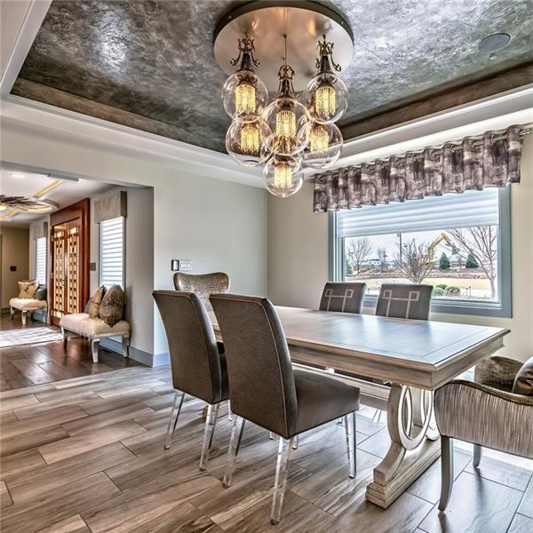 5 Little Meadow Road Wexford, PA 15090 - Photo 6 of 25 Dining Room with artfully designed Tray ceiling with mood lighting. Custom painted with a contemporary glamorous lighting feature. Ceramic Tile Flooring.