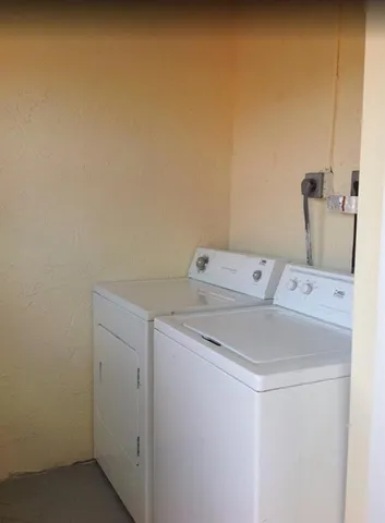 a view of a large yard with wooden fence