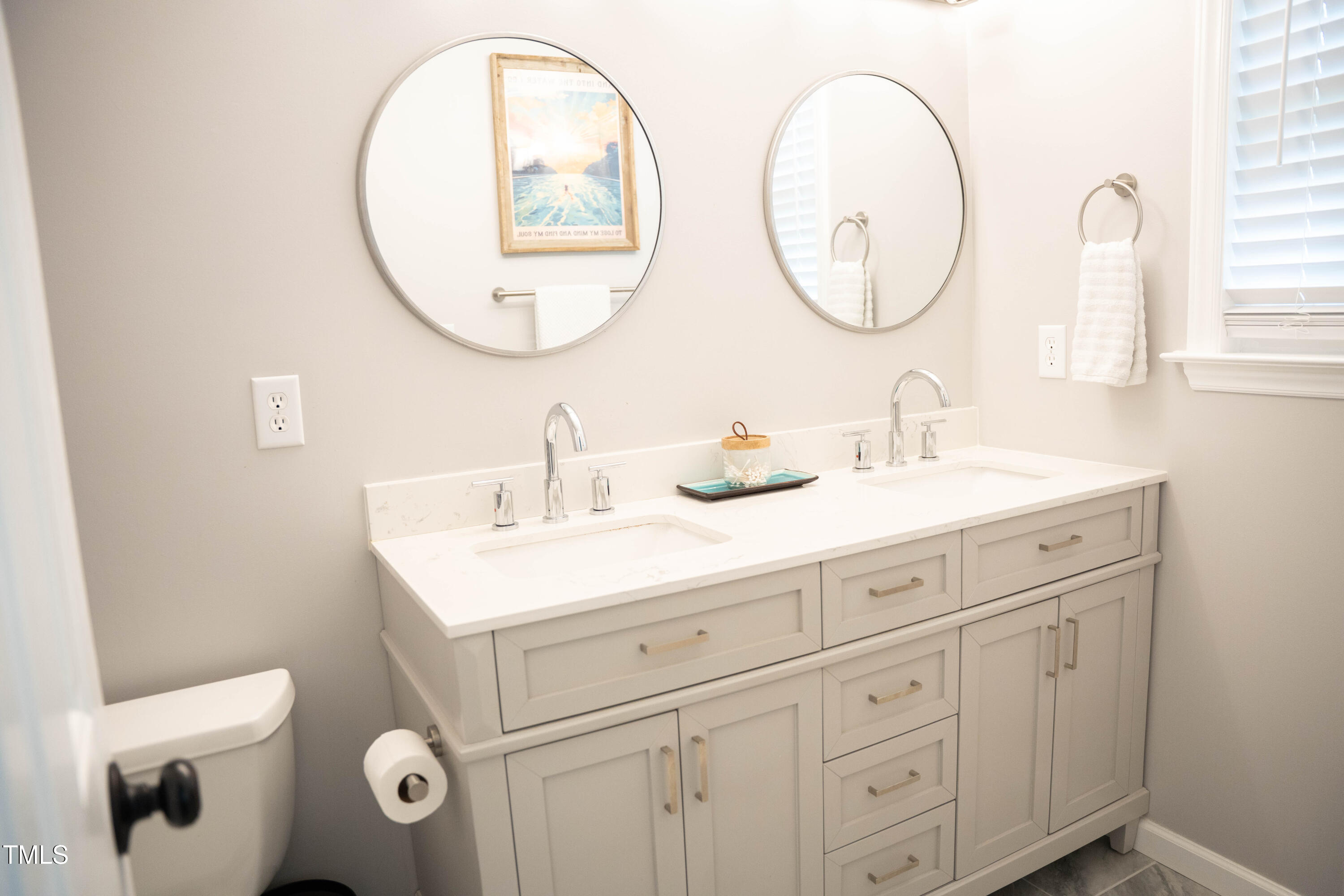 2036 Metacomet Way Raleigh, NC 27604 - Photo 8 of 21 a bathroom with a sink mirror and a toilet