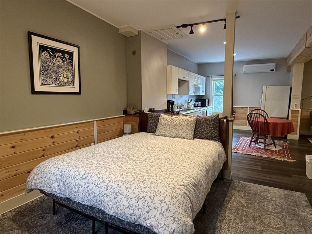 5 Bridge Street Montague, MA 01349 - Photo 13 of 36 a bed room with a bed and painting on the wall