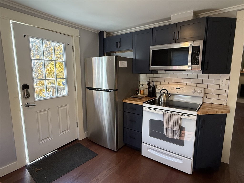 5 Bridge Street Montague, MA 01349 - Photo 18 of 36 a kitchen with stainless steel appliances a stove microwave and refrigerator