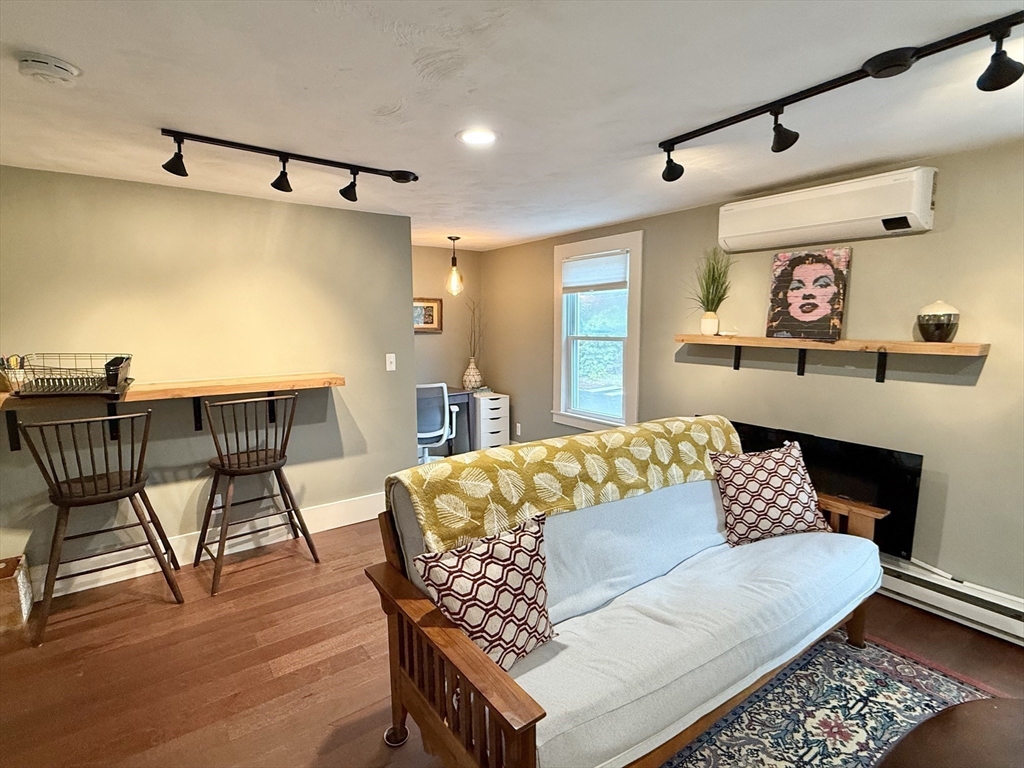 5 Bridge Street Montague, MA 01349 - Photo 20 of 36 a living room with furniture and a wooden floor