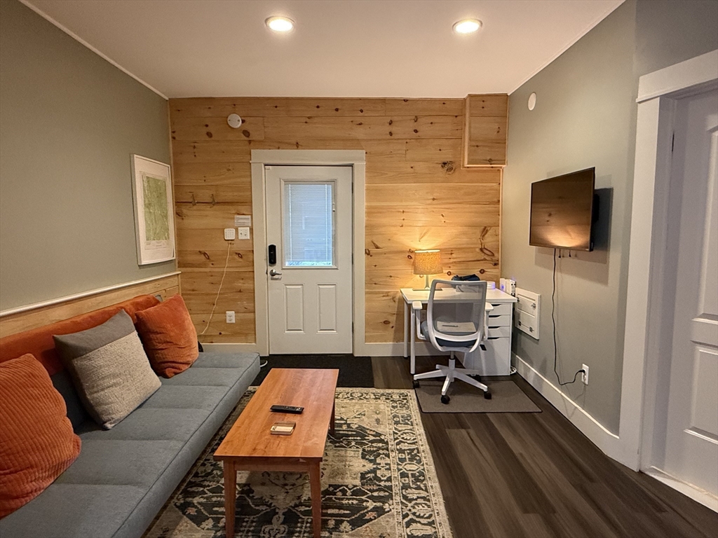 5 Bridge Street Montague, MA 01349 - Photo 2 of 36 a living room with furniture and a flat screen tv