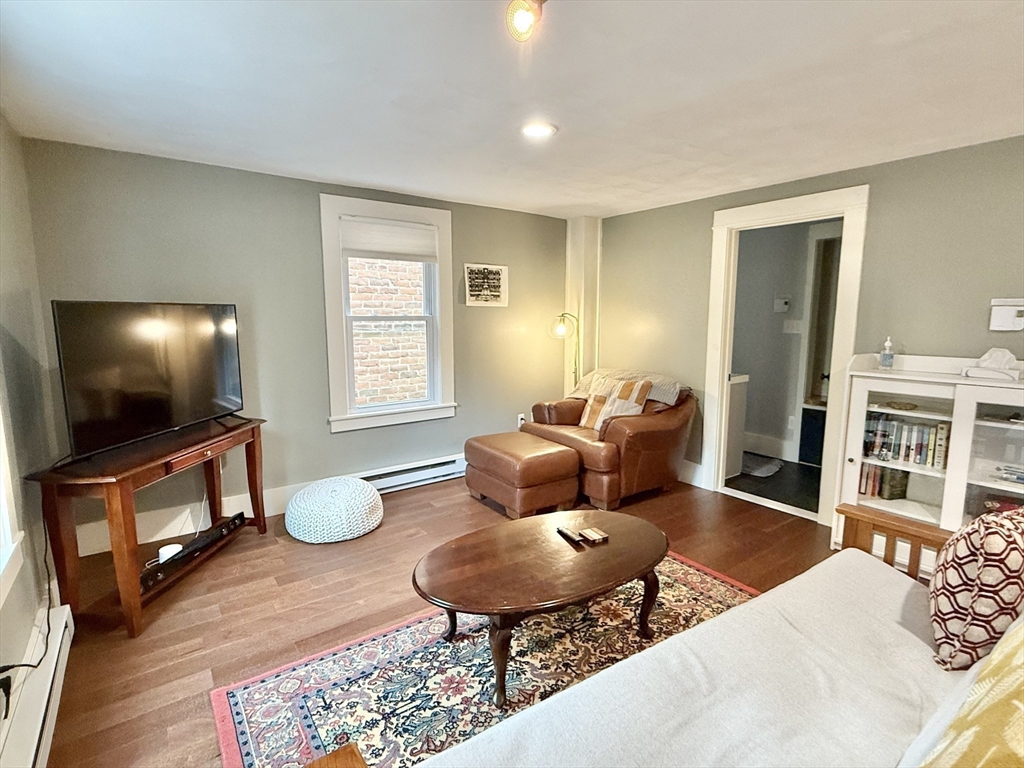 5 Bridge Street Montague, MA 01349 - Photo 21 of 36 a living room with furniture and a flat screen tv
