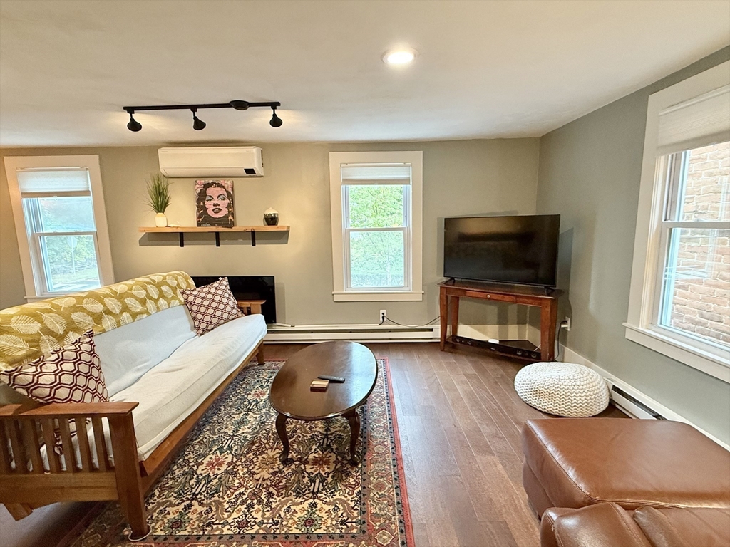 5 Bridge Street Montague, MA 01349 - Photo 22 of 36 a living room with furniture and a flat screen tv
