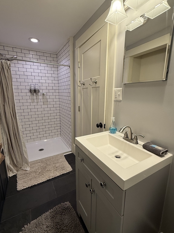 5 Bridge Street Montague, MA 01349 - Photo 24 of 36 a bathroom with a sink a toilet and shower