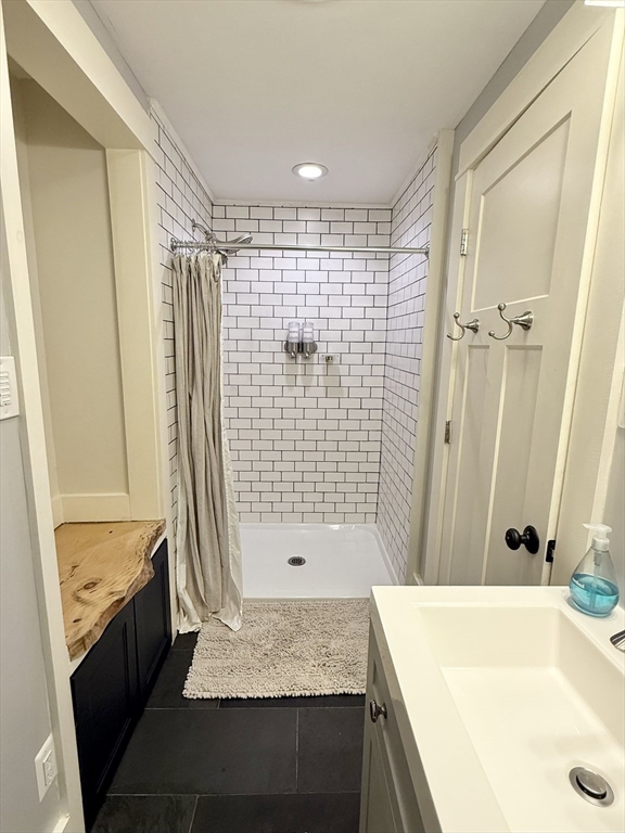 5 Bridge Street Montague, MA 01349 - Photo 25 of 36 a bathroom with a granite countertop sink a bathtub and shower