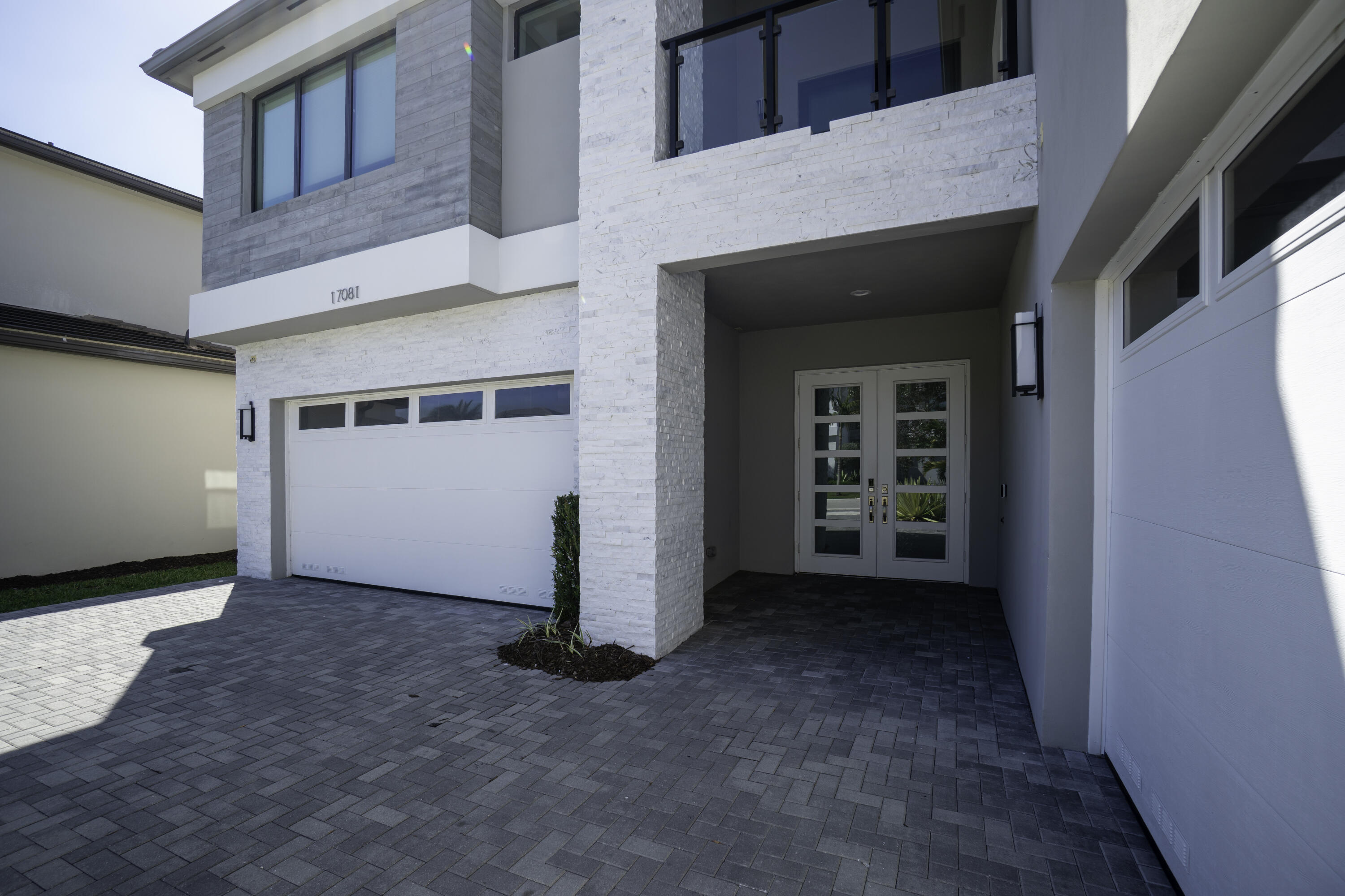 17081 Five Waters Avenue Boca Raton, FL 33496 - Photo 15 of 109 a view of a blue house with a outdoor space