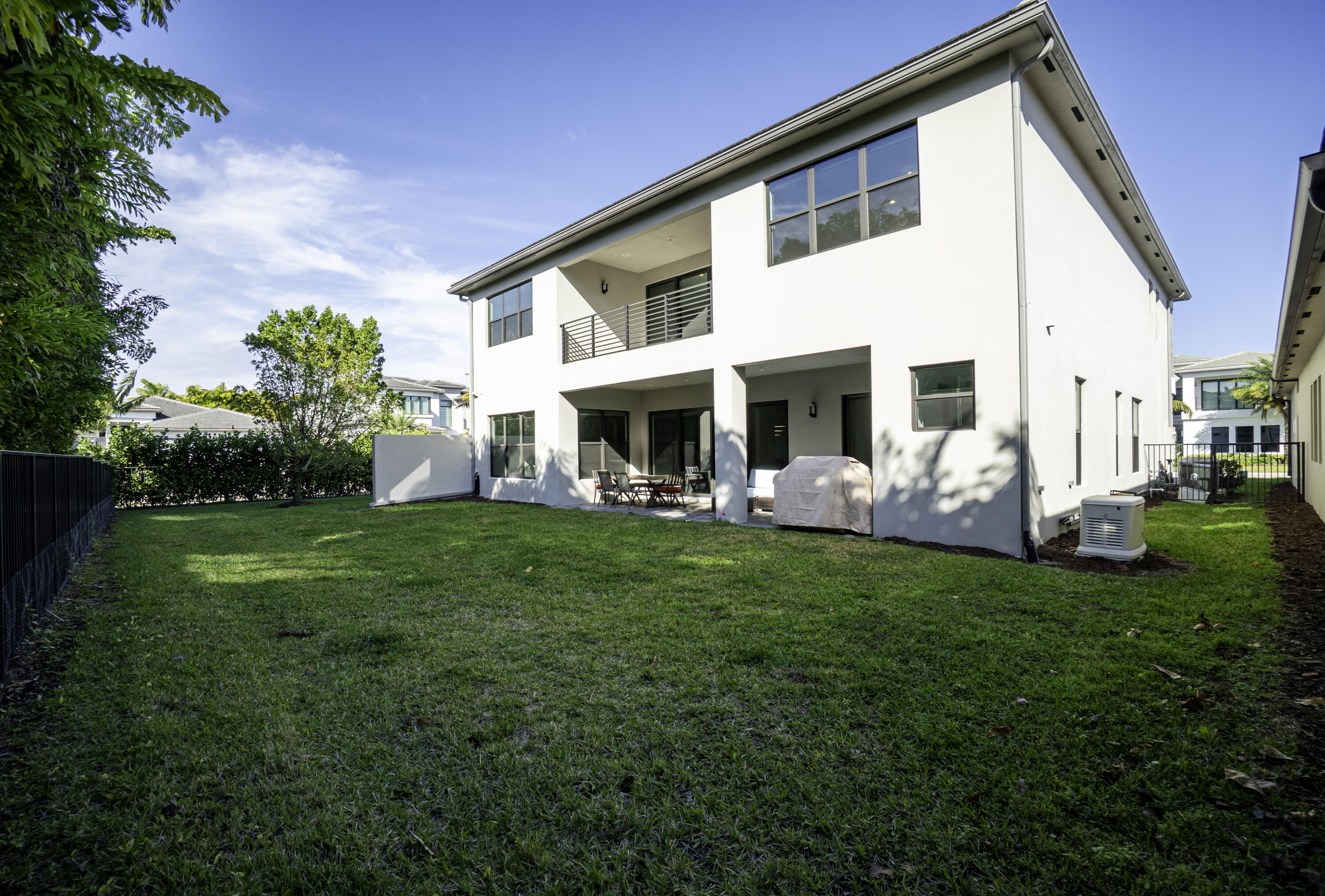 17081 Five Waters Avenue Boca Raton, FL 33496 - Photo 18 of 109 a view of a house with a backyard
