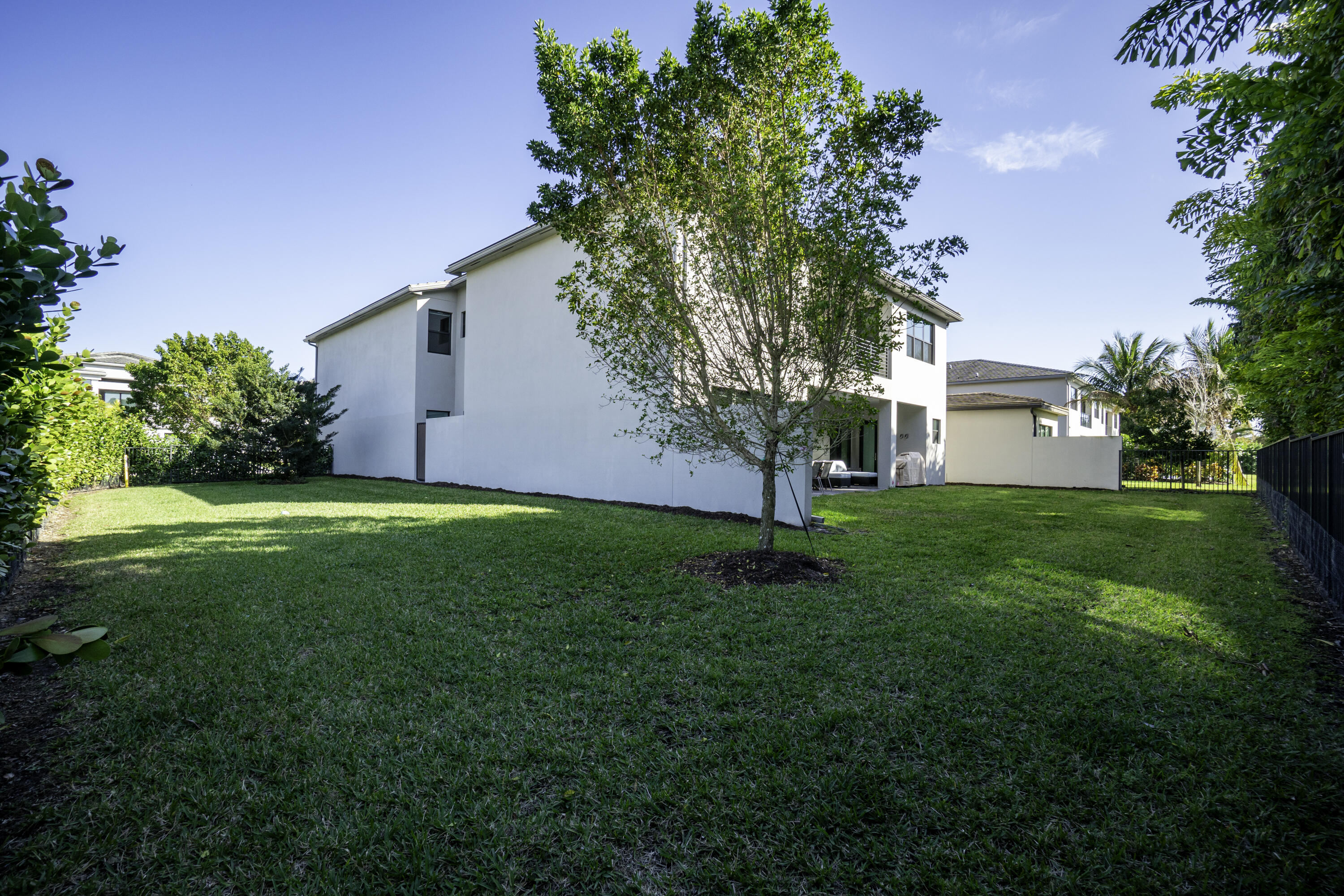 17081 Five Waters Avenue Boca Raton, FL 33496 - Photo 20 of 109 a view of a house with backyard and garden