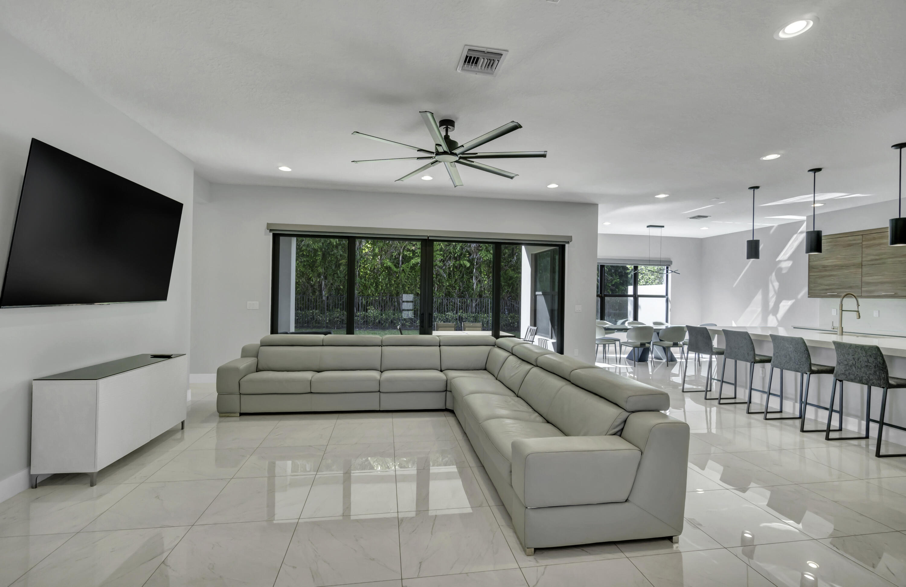 17081 Five Waters Avenue Boca Raton, FL 33496 - Photo 26 of 109 a living room with furniture and a flat screen tv