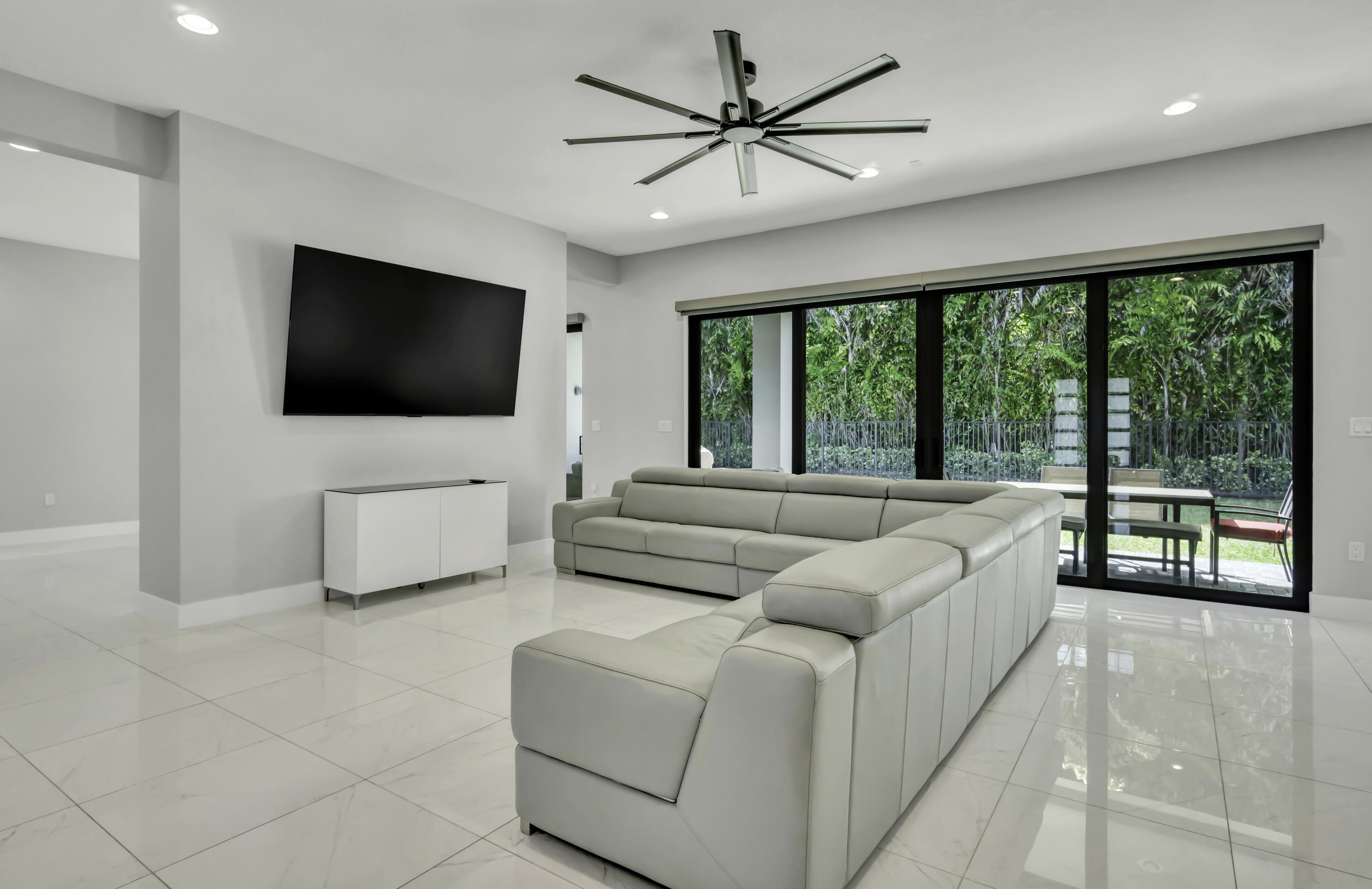 17081 Five Waters Avenue Boca Raton, FL 33496 - Photo 27 of 109 a living room with furniture and a flat screen tv