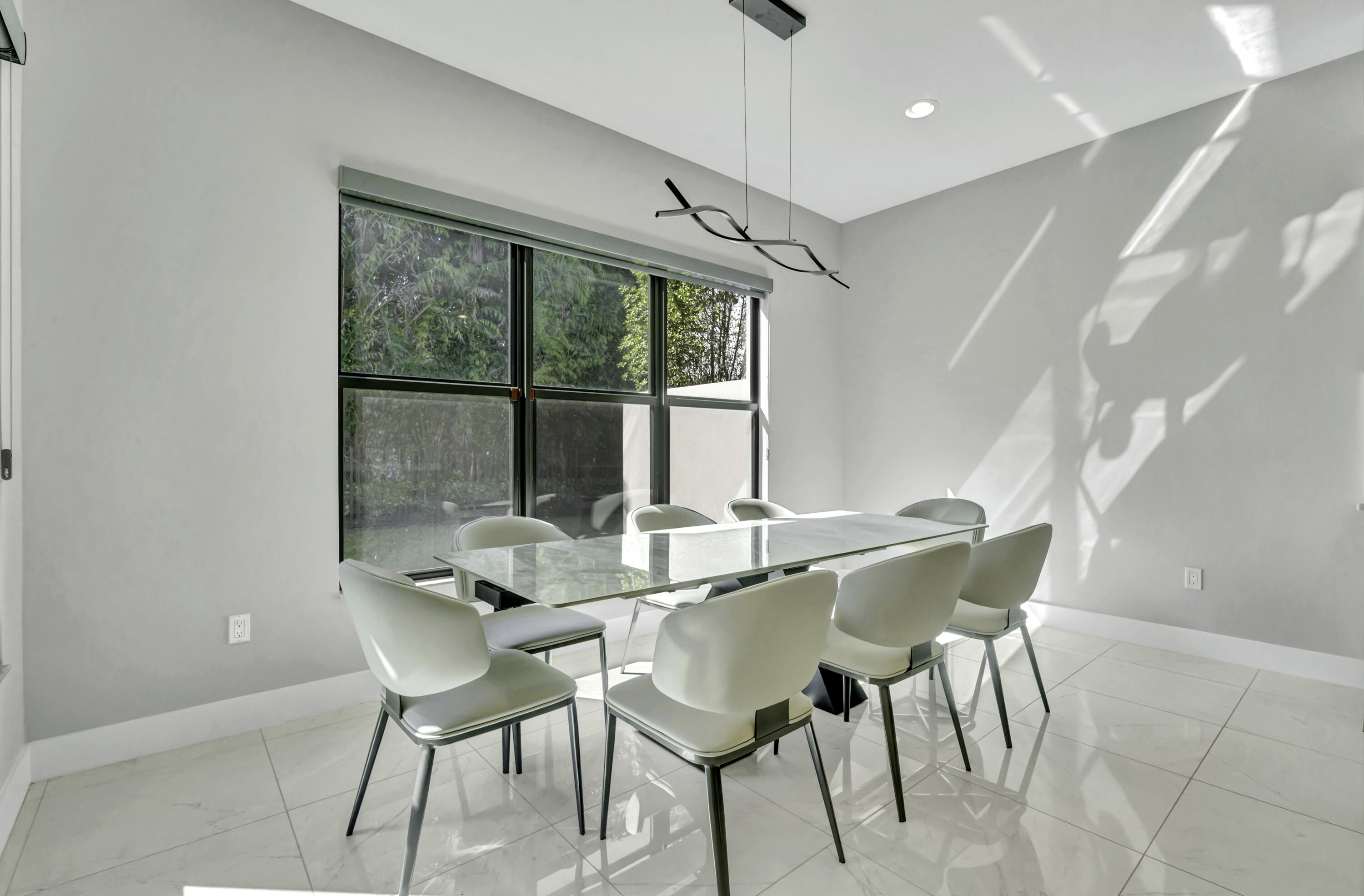 17081 Five Waters Avenue Boca Raton, FL 33496 - Photo 31 of 109 a view of a dining room with furniture window and outside view