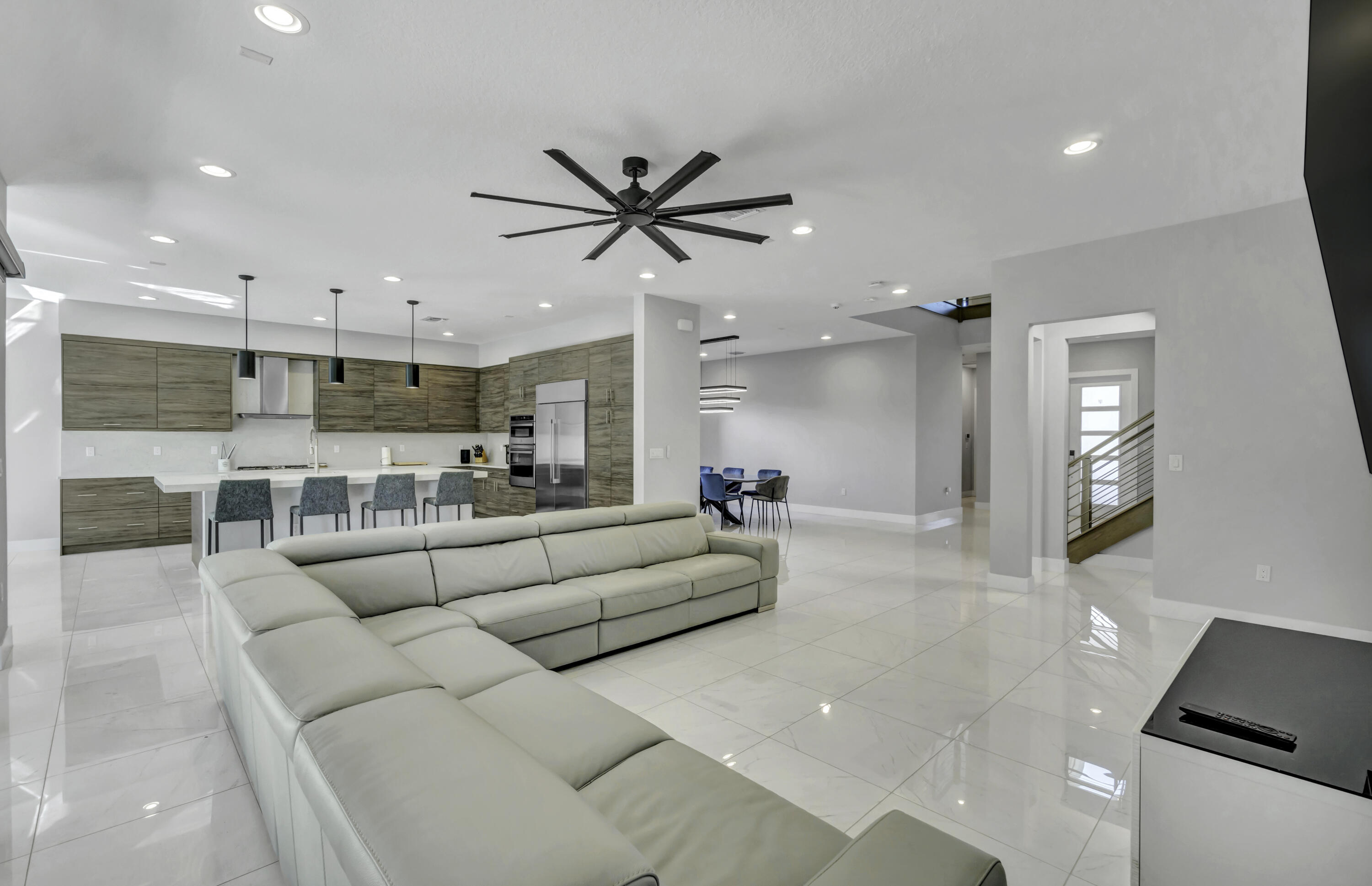 17081 Five Waters Avenue Boca Raton, FL 33496 - Photo 36 of 109 a living room with furniture and a view of kitchen