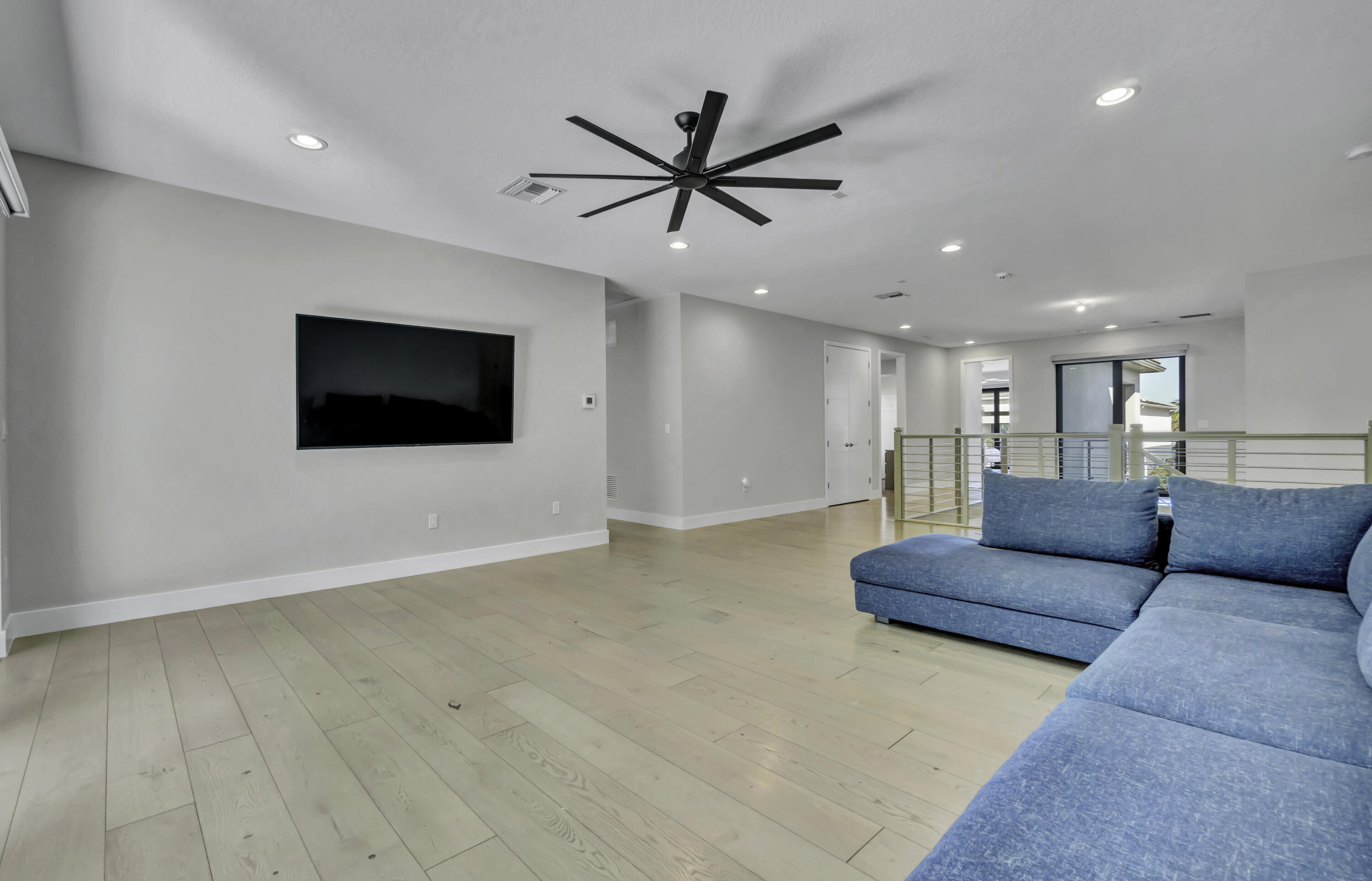 17081 Five Waters Avenue Boca Raton, FL 33496 - Photo 47 of 109 a living room with furniture and a flat screen tv