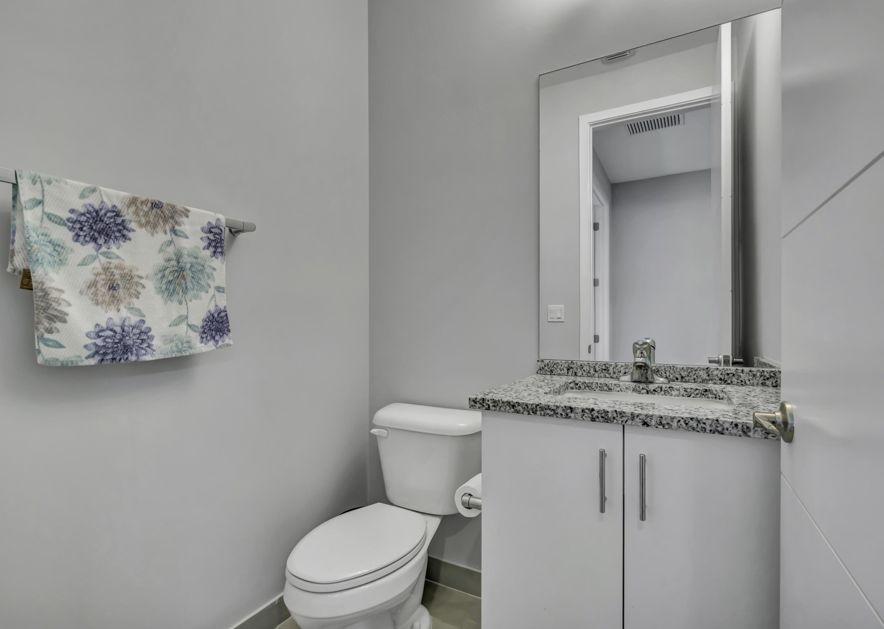 17081 Five Waters Avenue Boca Raton, FL 33496 - Photo 52 of 109 a bathroom with a granite countertop toilet sink and mirror