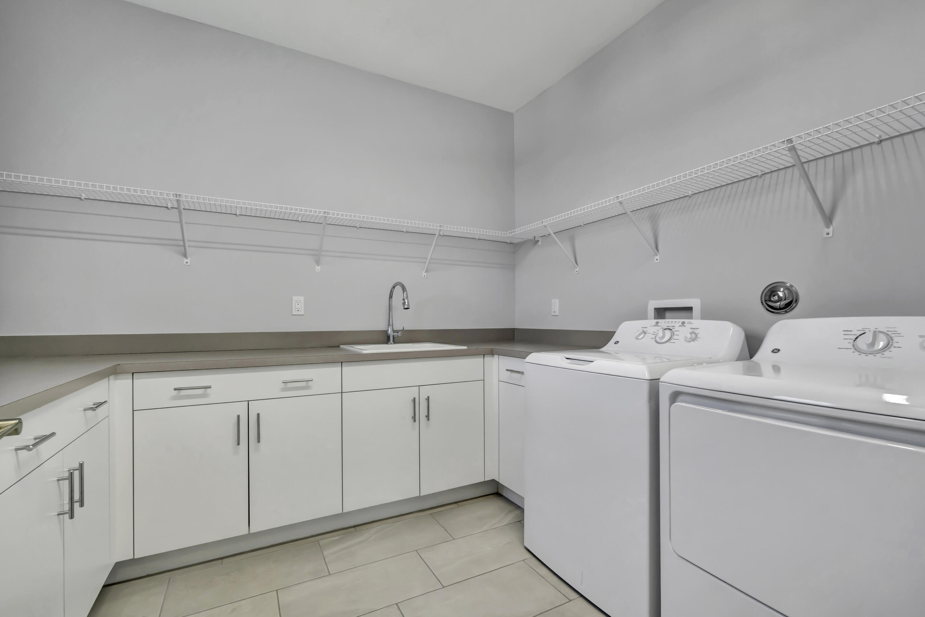 17081 Five Waters Avenue Boca Raton, FL 33496 - Photo 53 of 109 a utility room with sink dryer and washer