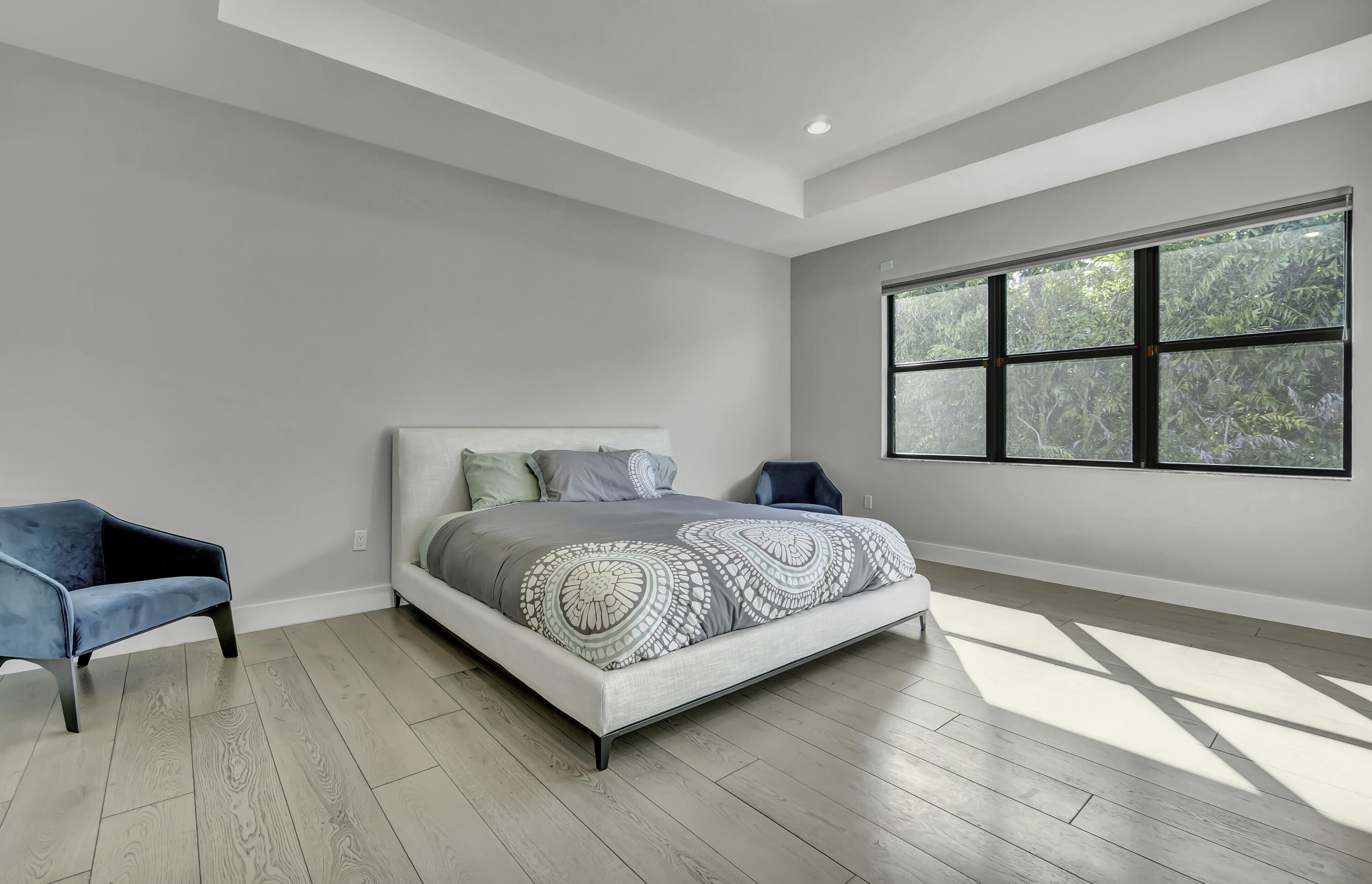 17081 Five Waters Avenue Boca Raton, FL 33496 - Photo 54 of 109 a bedroom with a bed and a large window