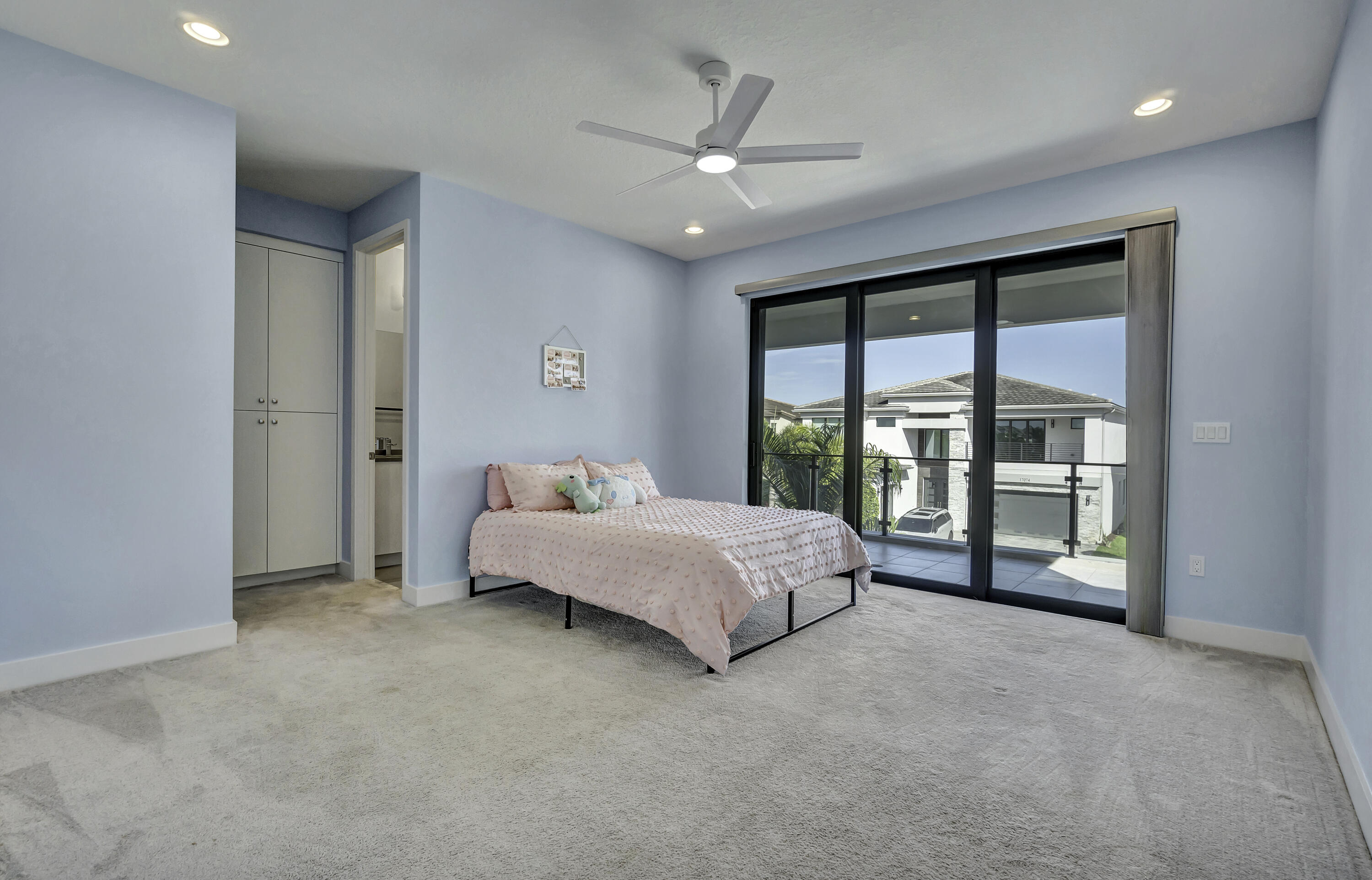 17081 Five Waters Avenue Boca Raton, FL 33496 - Photo 60 of 109 a spacious bedroom with a large bed and a large window