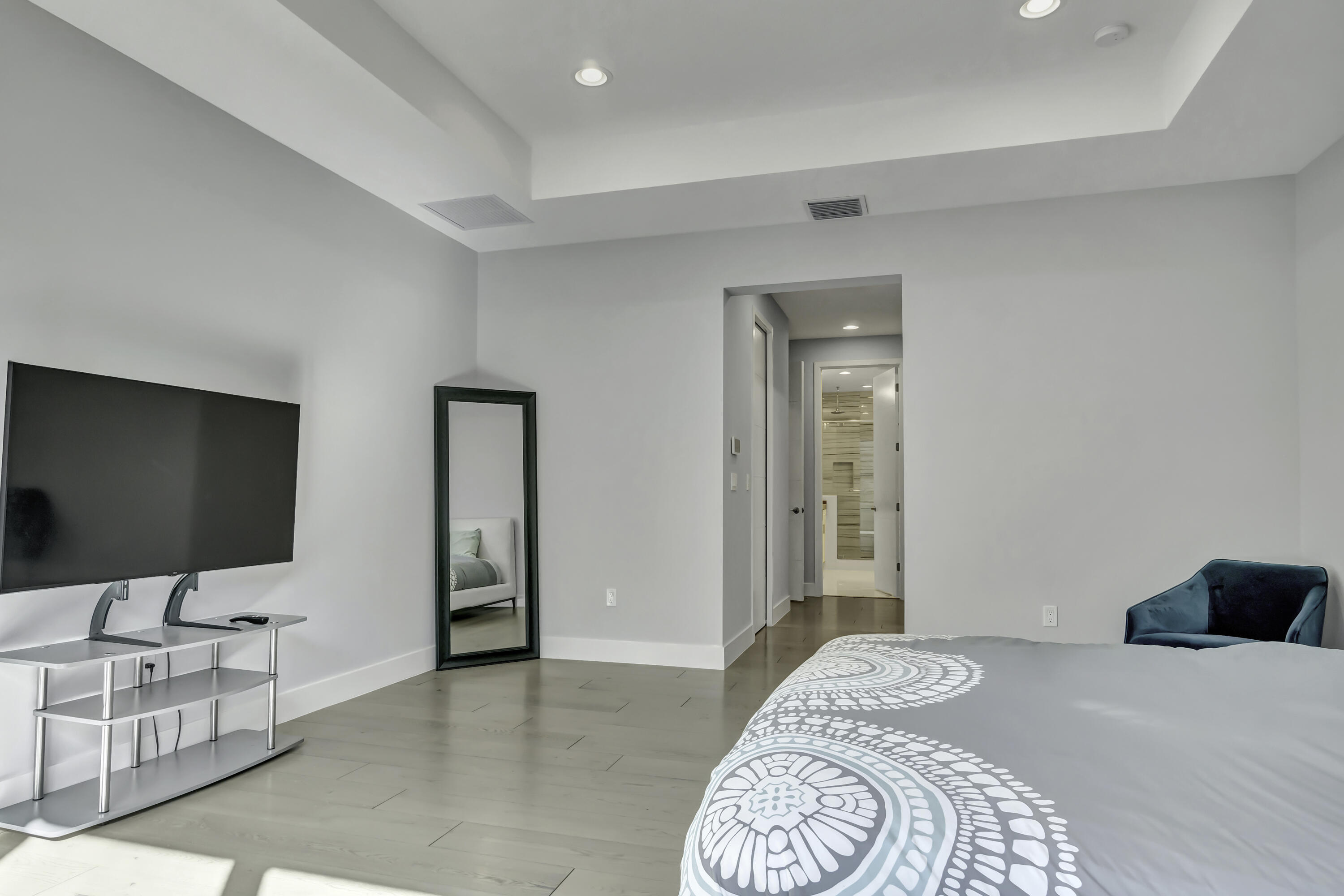 17081 Five Waters Avenue Boca Raton, FL 33496 - Photo 65 of 109 a bedroom with a bed and a flat screen tv