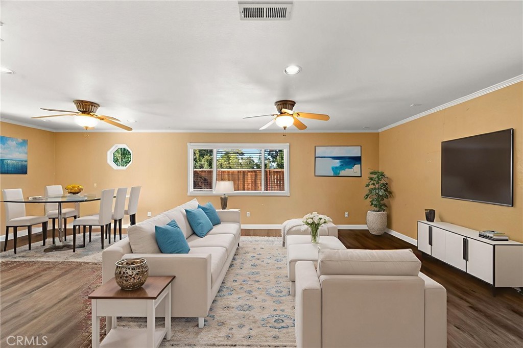 40219 Donomore Court Temecula, CA 92591 - Photo 19 of 63 a living room with furniture and a flat screen tv