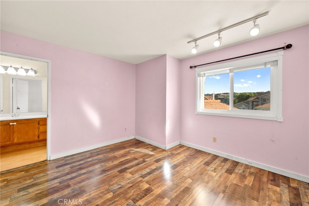 40219 Donomore Court Temecula, CA 92591 - Photo 39 of 63 a view of empty room with wooden floor and fan