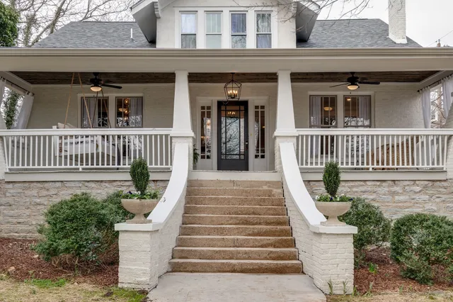 a view of a house with wooden fence