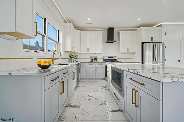 a kitchen with a sink stove and refrigerator