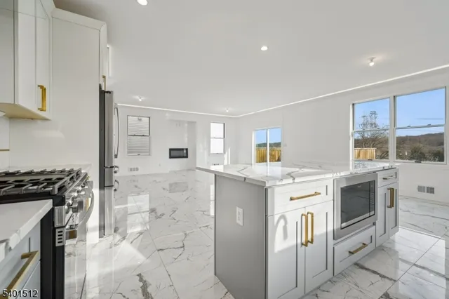 a kitchen with a stove and a refrigerator