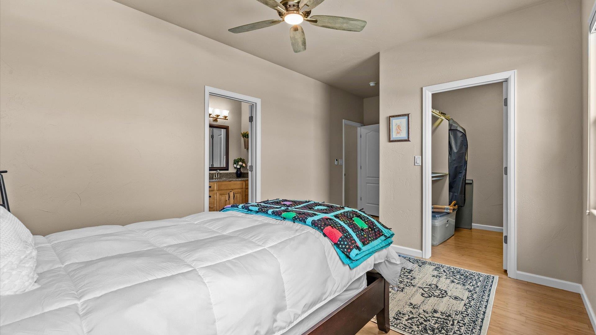1712 Powis Lane Fruita, CO 81521 - Photo 28 of 39 a bedroom with a bed and a window