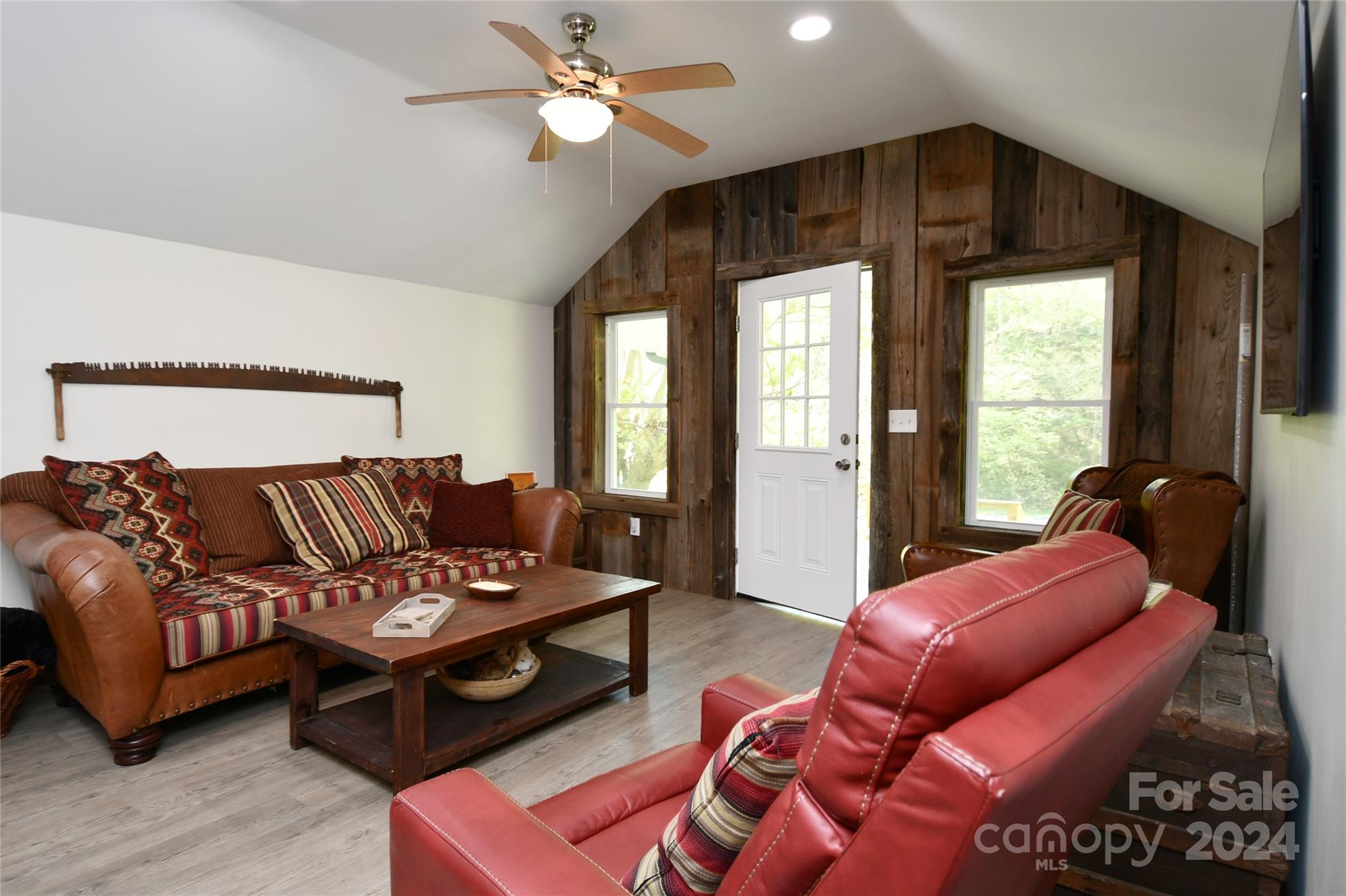 2180 Pigeon Roost Road Green Mountain, NC 28740 - Photo 12 of 47 a living room with furniture ceiling fan and a window